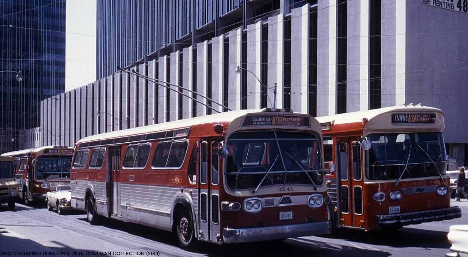 19730000 - Multiple Routes - Buses heading  north on Yonge past Canada Square